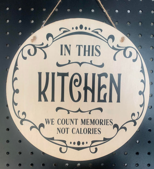 ROUND IN THIS KITCHEN WE COUNT MEMORIES SIGN